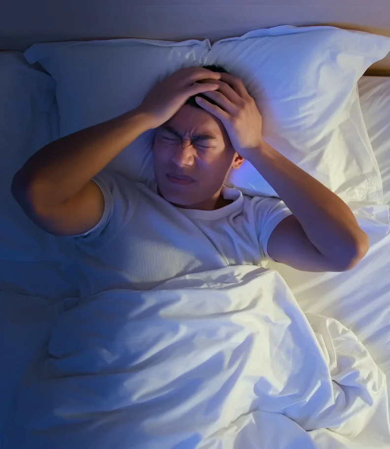 man experiencing headaches in CITY* STATE*